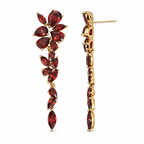Sedy Jewelry floral chandelier earrings feature gold plating and cubic zirconia stones in a choice of red or green. Pear-shaped and marquise stones form a cascading botanical design. Each earring measures 5.5 cm (2.17 in) long and 1.5 cm (0.59 in) wide and has a stud-post fastening. Sold as a pair.